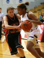 RMC's Chanel Jones-Delas tries to go by IIT's Erin Pedersen in Tuesday's game